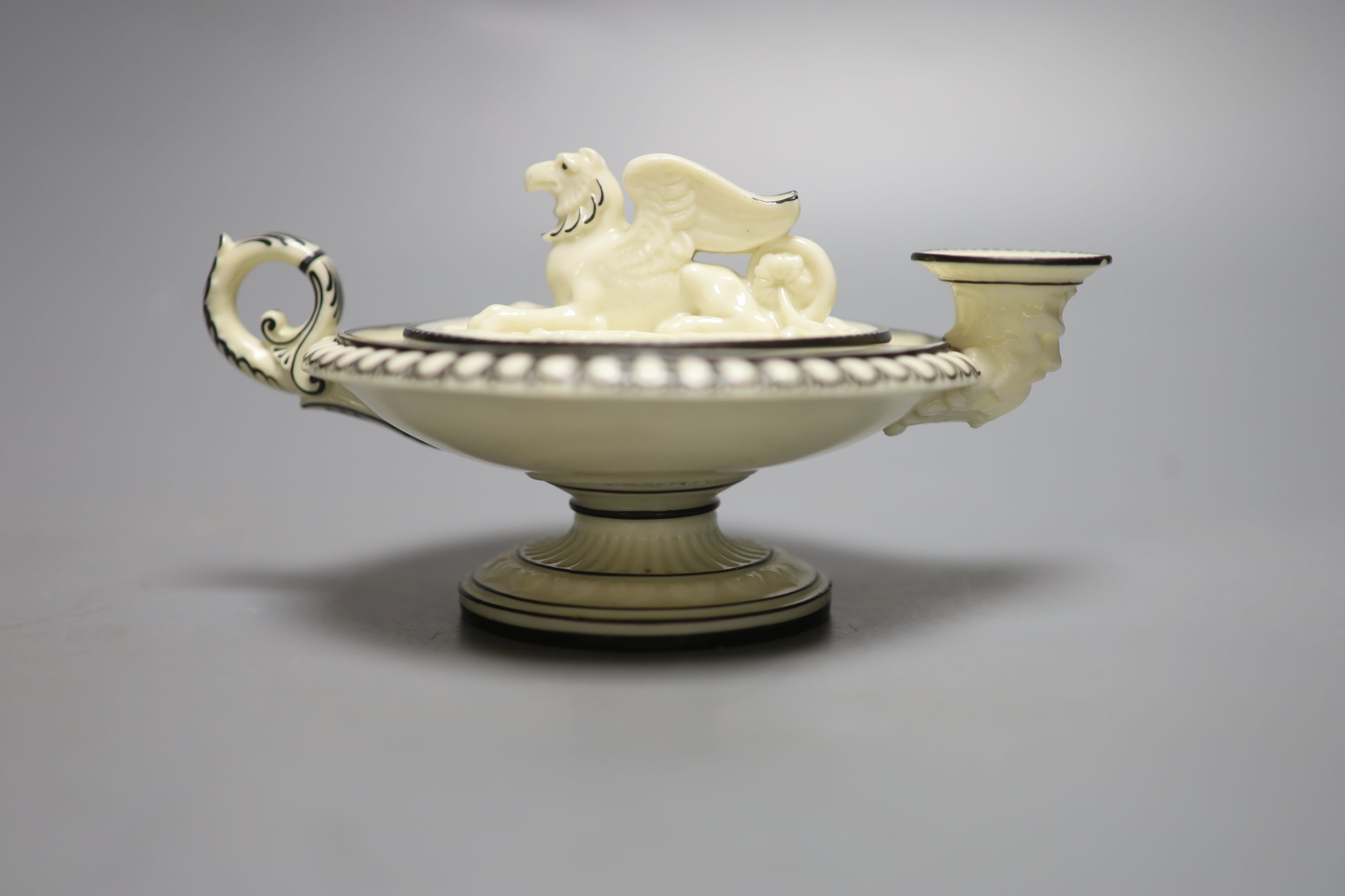 A rare Royal Worcester Kerr and Binns period inkwell, in the form of an oil lamp, with griffin finial